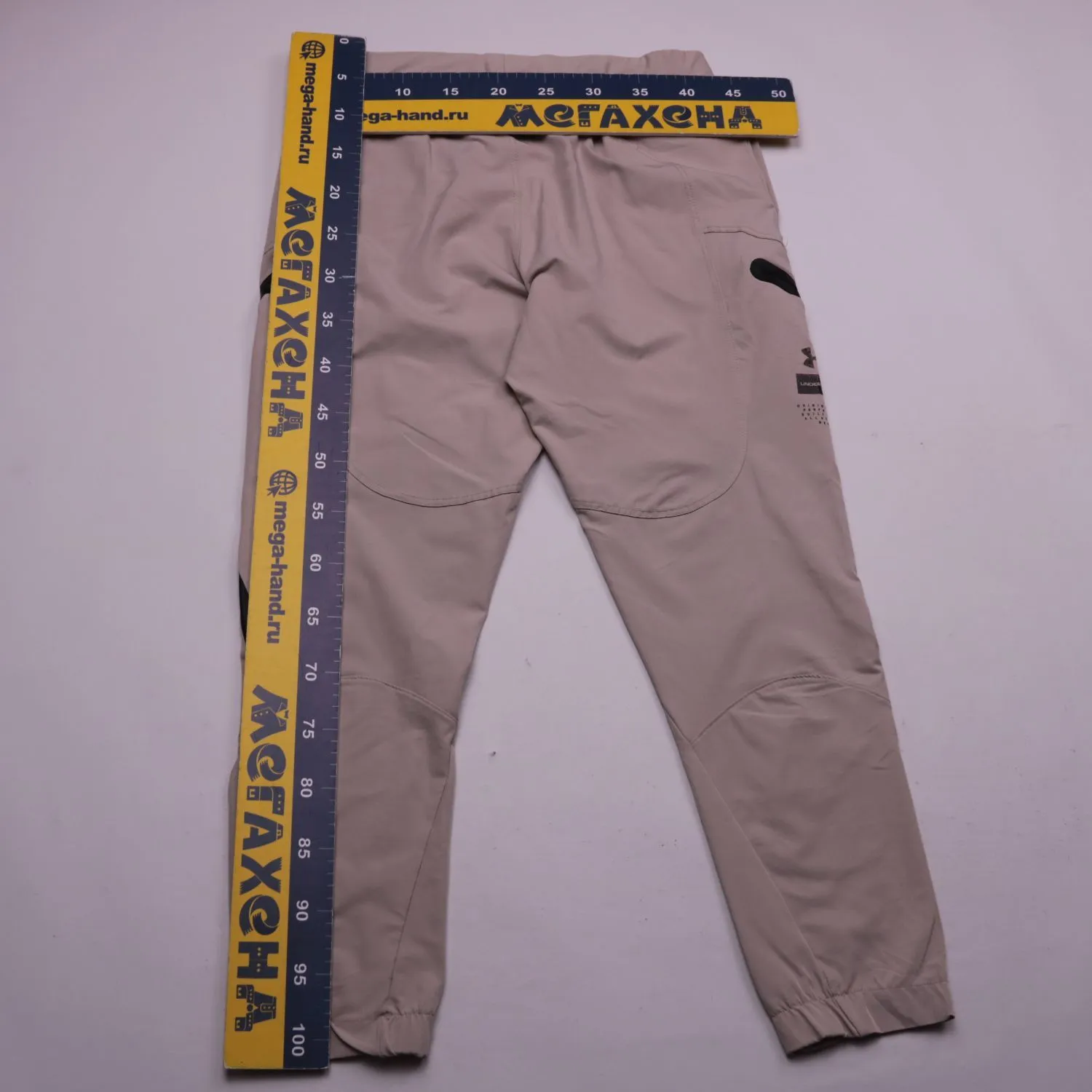 Бежевые брюки Under Armour с карманами на молниях, размер 54 (XL)